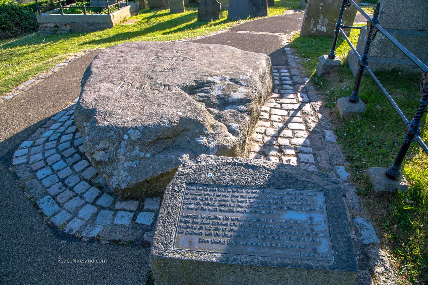 St Patrick's tombstone and local Council plaque at Down Cathedral
